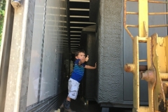 Loading blinds with our grandson